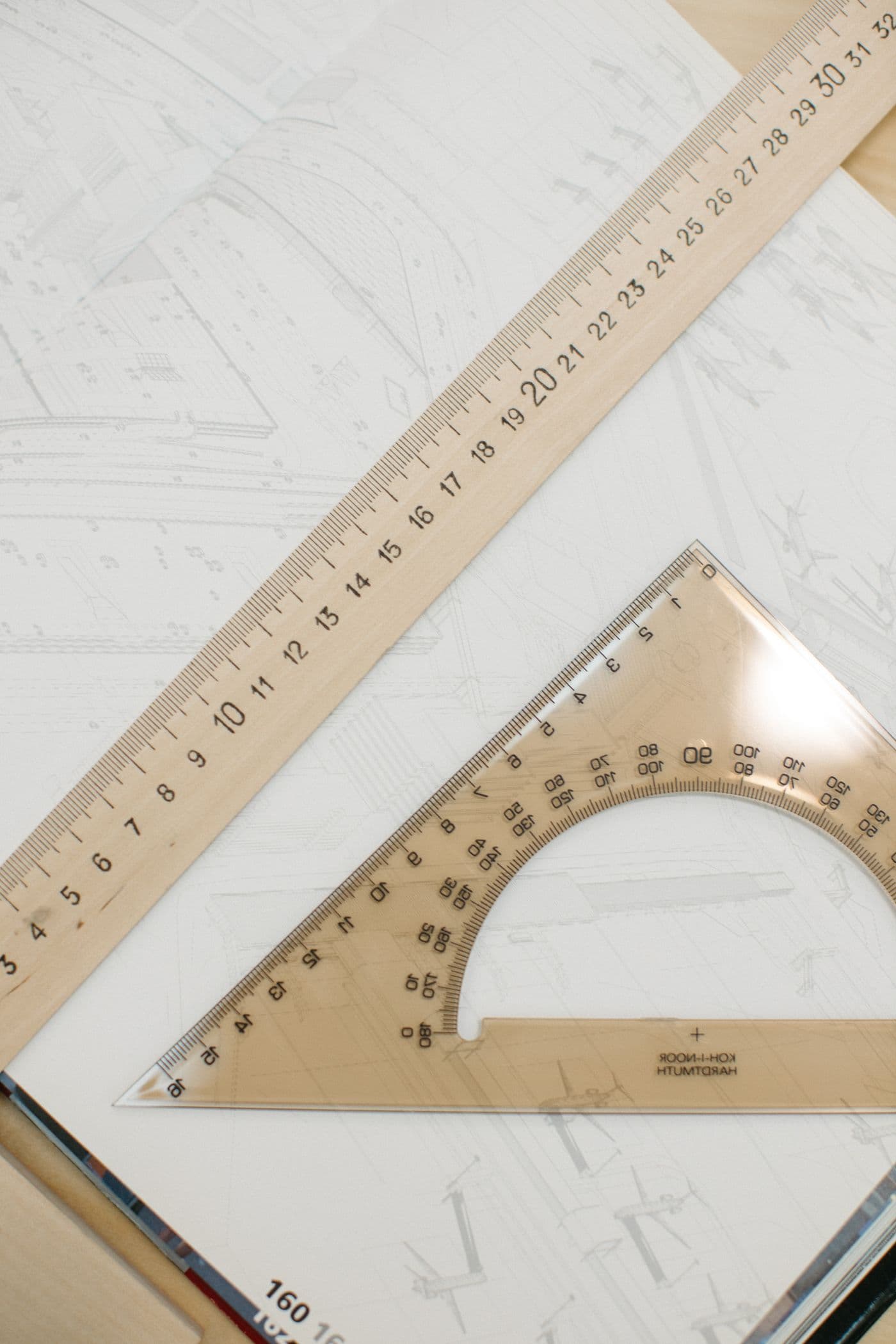 Architectural plans with rulers and a protractor
